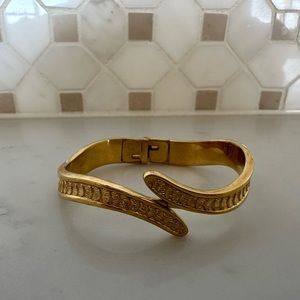 Vintage Monet Shell pattern gold tone clamper bracelet.